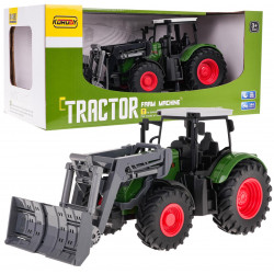 Zelený traktor s buldozérom